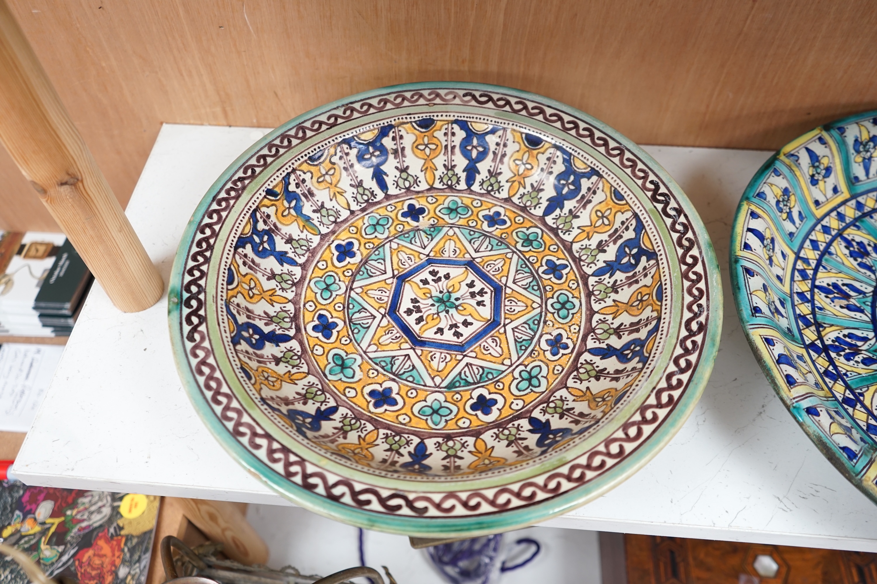 Two 19th/20th century Moroccan polychrome pottery dishes, 41cm diameter. Condition - fair to good